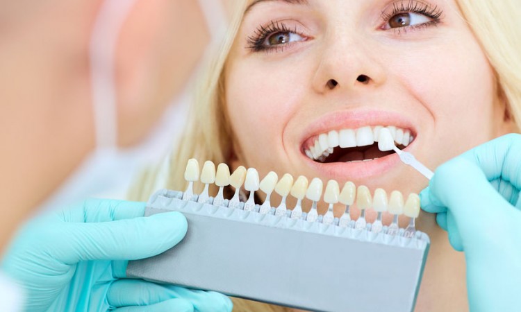 Closeup of a girl with a beautiful smile at the dentist.  Dental care concept